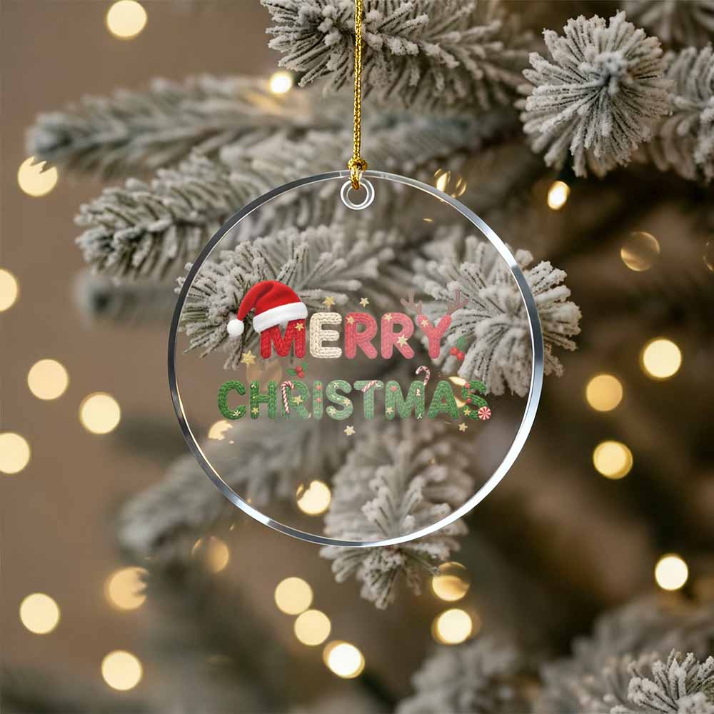 Christmas ornament with 'Merry Christmas' text on a decorated tree.