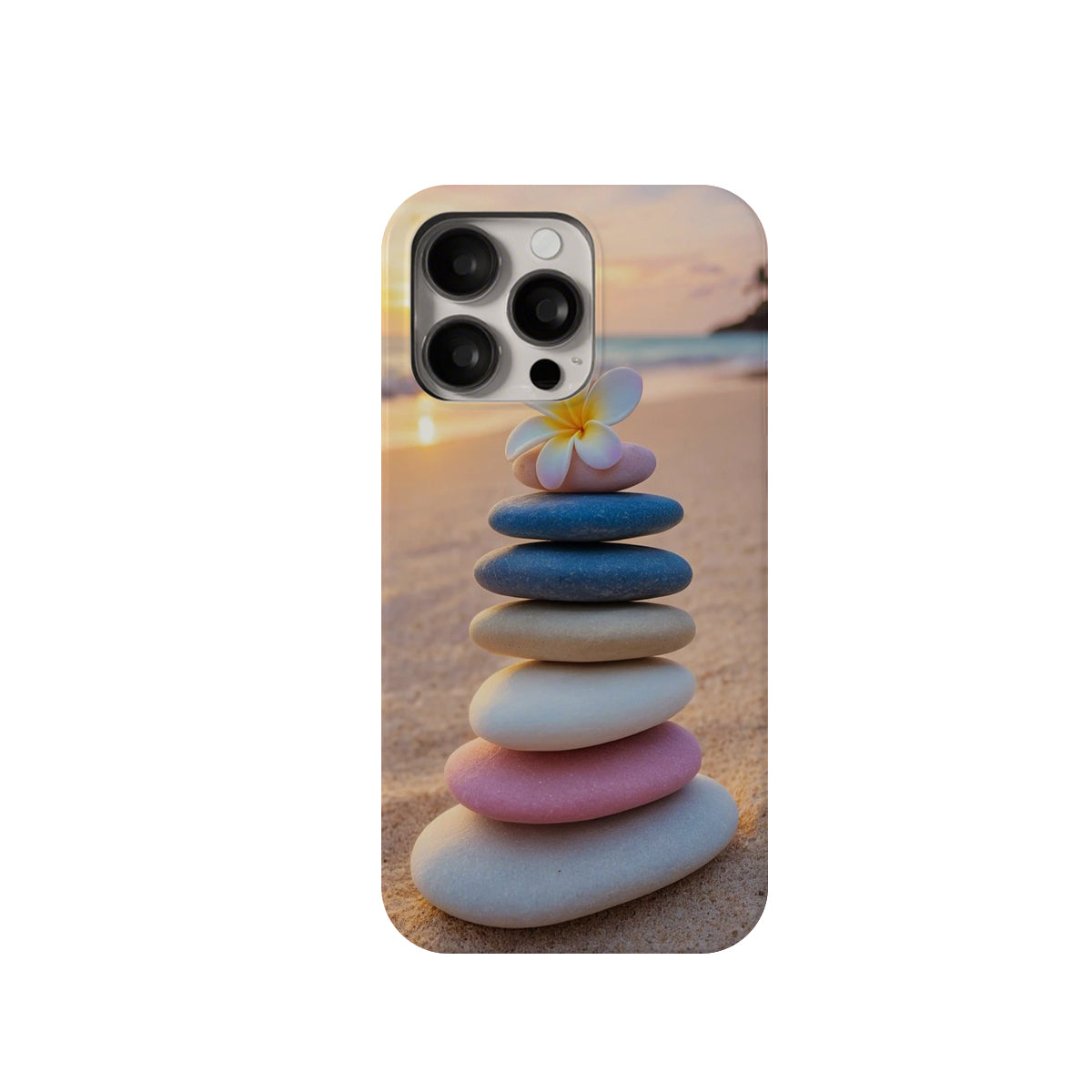 Phone case with a stack of colorful stones and a flower on a beach background