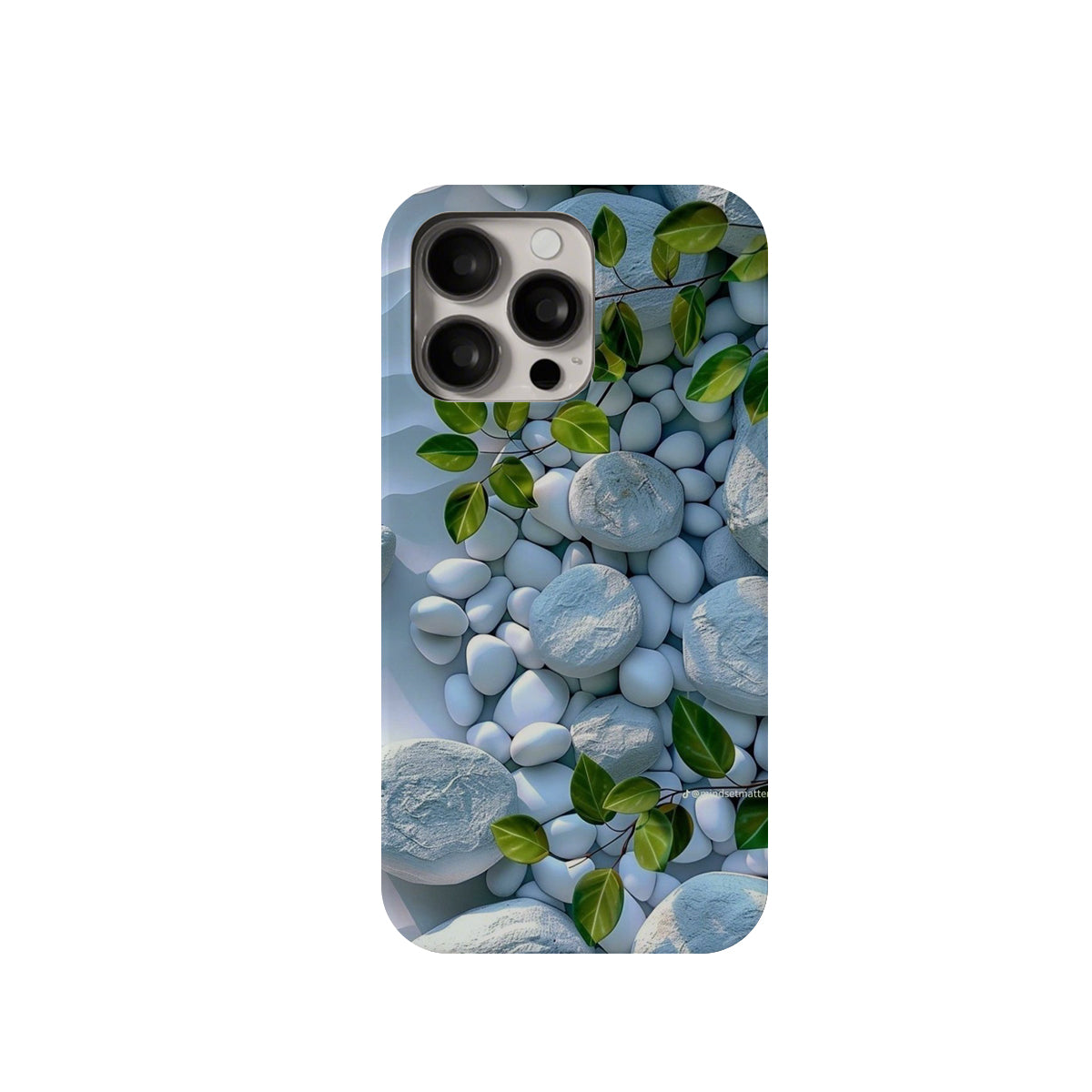 Phone case with pebbles and leaves design on a white background