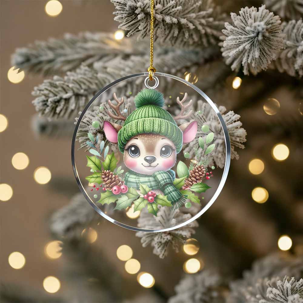 Christmas ornament with a cute animal wearing a green hat and scarf on a decorated tree.