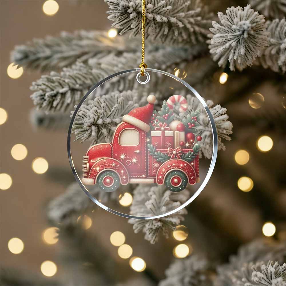 Christmas ornament with a red truck and Santa hat on a decorated tree.
