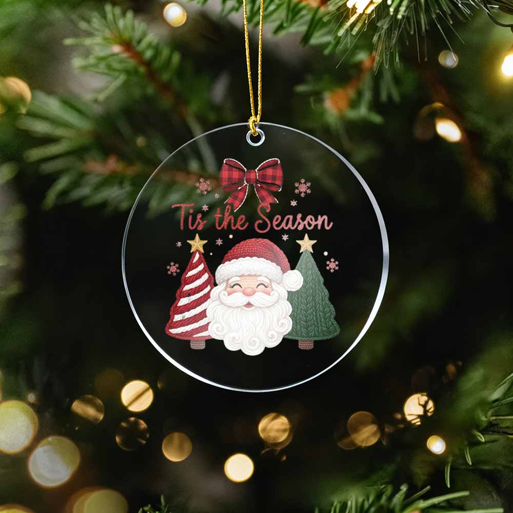Christmas ornament with Santa Claus and 'Tis the Season text on a tree with lights.