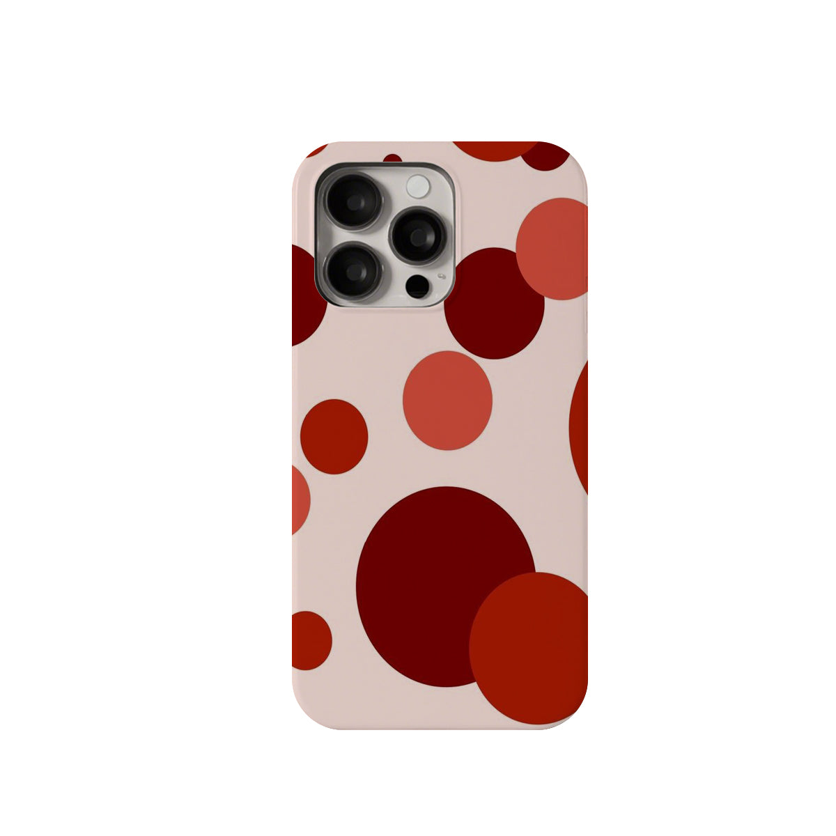 Phone case with red and brown polka dot pattern on a beige background